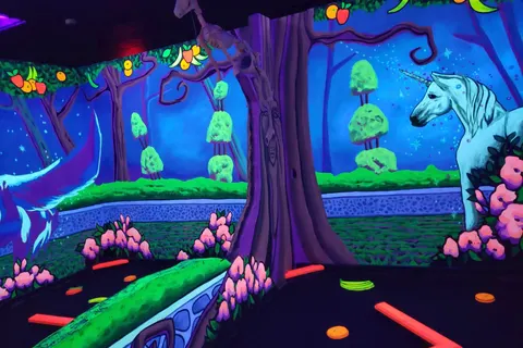 Glowing unicorn forest mural at the Gilbert location