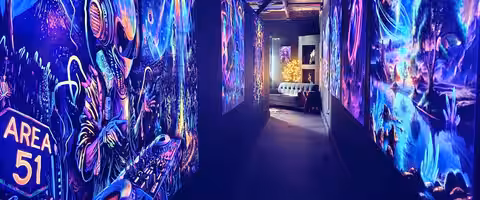 Glowing mural corridor at the Sedona location